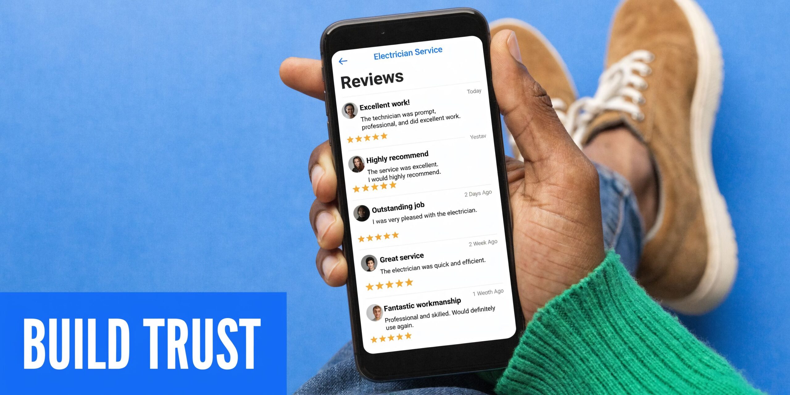 A person holding a smartphone displaying customer reviews for an electrician service to demonstrate business credibility.